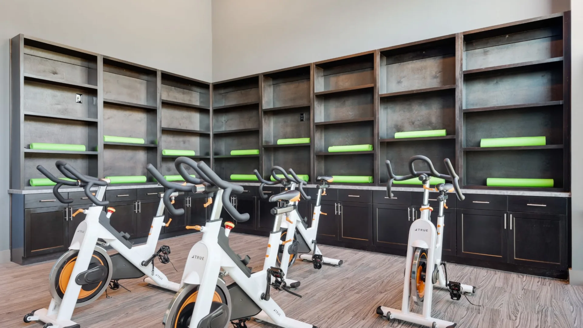 a row of stationary bikes in a gym at The Discovery Park